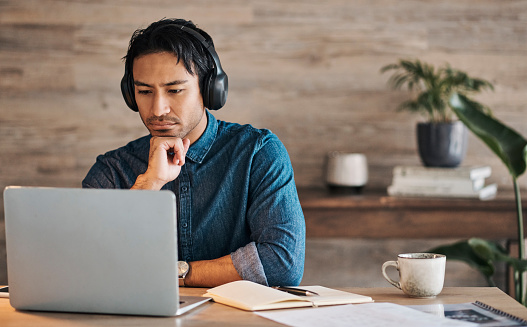 Man reading from a laptop
