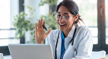 Doctor meeting virtually with a resident.